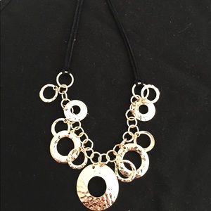 Gold and black necklace.